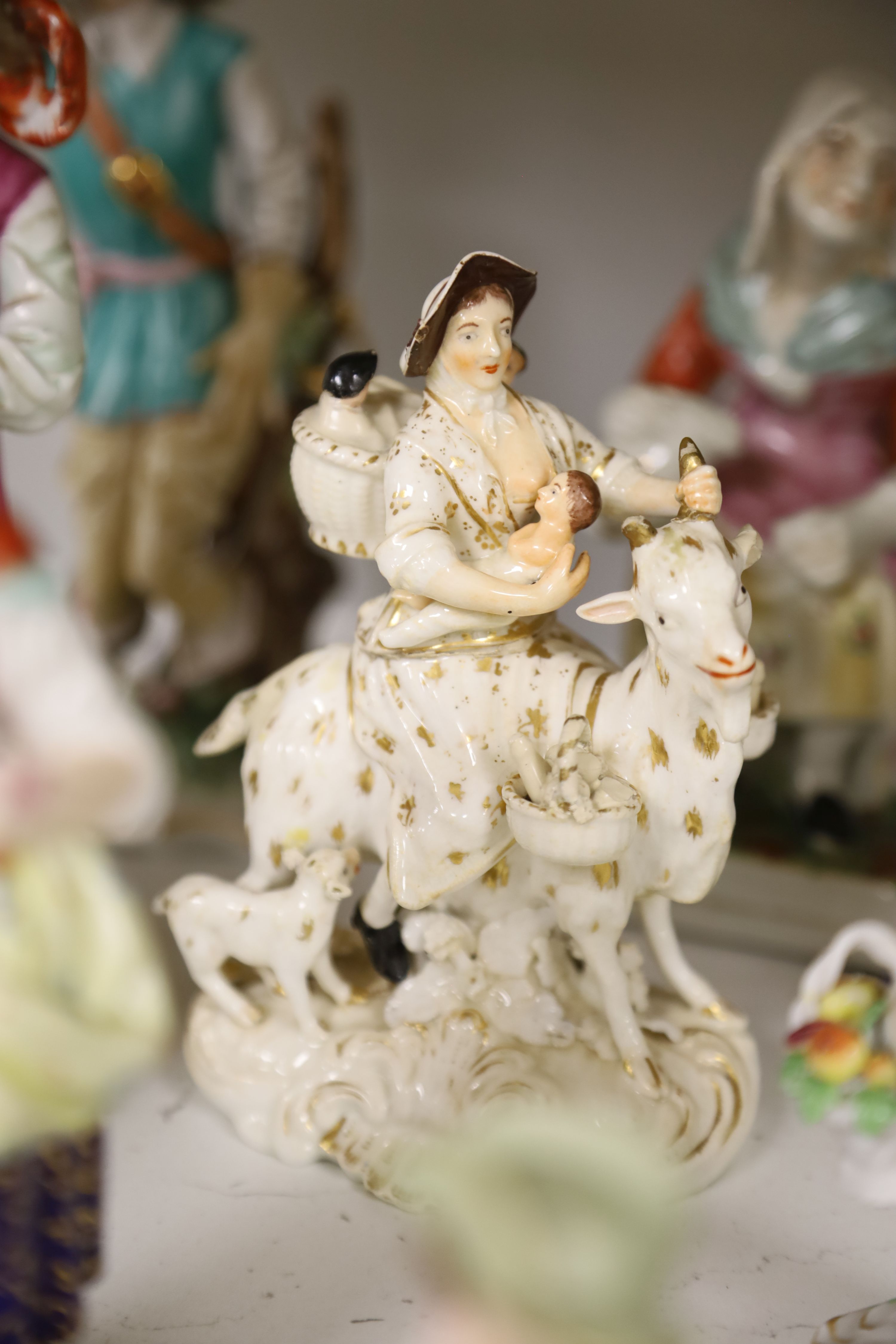 A Derby tailors wife group and twelve Continental or Staffs porcelain figures, tallest 20cm